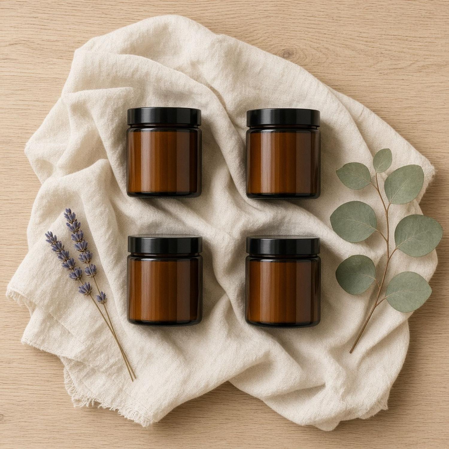 Four small Halden amber candles: Cashmere, Evergreen, Bath House and Hearth