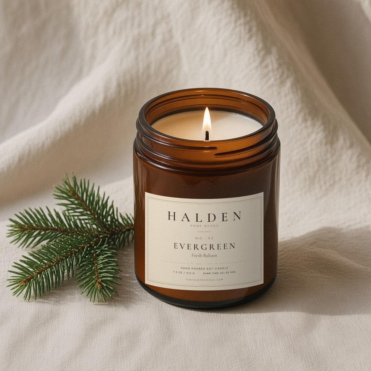 Halden No. 03 Evergreen hand-poured soy candle in an amber jar, a crisp forest scent