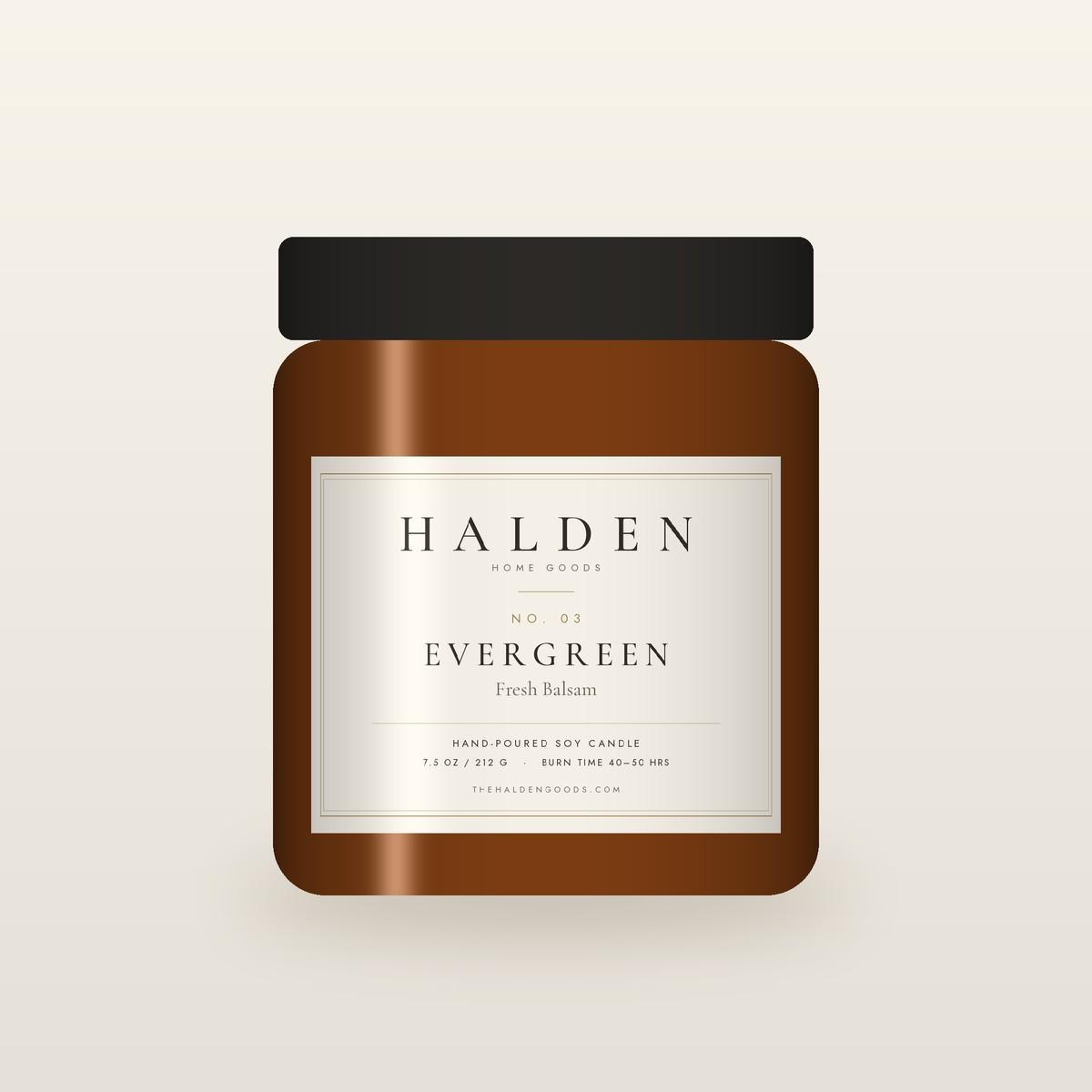 Halden No. 03 Evergreen hand-poured soy candle in an amber jar, a crisp forest scent